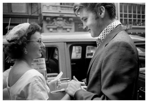 Elvis_greets_fan_in_white