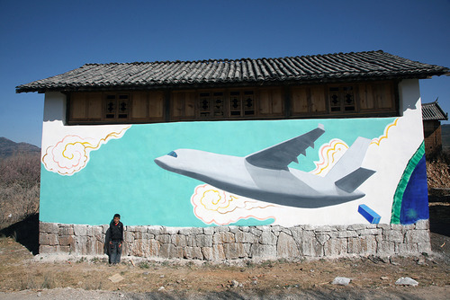 20120724140739-liu_bin____cargo_plane_above_lashihai__mural_at_he_simei_s_house