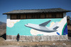 20120724140739-liu_bin____cargo_plane_above_lashihai__mural_at_he_simei_s_house