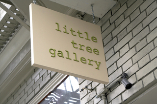 little tree gallery sign; hanging  tough,