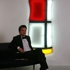 Nicolas_gregoire_seated_in_front_of_his_light_sculpture