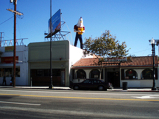 Chicken Boy atop Future Studio Gallery,