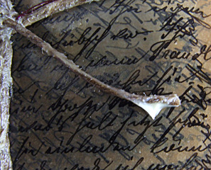Stereo microscopy identifies handwriting on Object 24, apparently a package of letters encased in beeswax,Iris Häussler