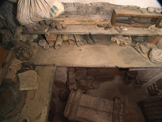Installation detail of the inside of a hidden chamber, concealed behind a plaster coat in the basement of the historic Grange. A significant amount of beeswax was found, together with artefacts and simple tools.,Iris Häussler