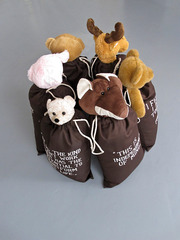 6 bagsculptures with softtoy and text in a circle,Mario Dalpra
