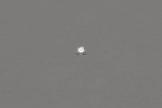 Dust magnified by a diamond,Wilfredo Prieto