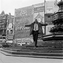 Mike Eghan at Picadilly Circus, London  ,