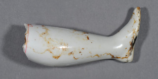 Porcelain doll leg,