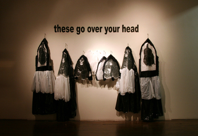 Post-post-apocalypse_-_edith_abeyta_-_ruins_-_gorilla_suits_with_wall_text_-_installed