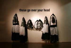 Post-post-apocalypse_-_edith_abeyta_-_ruins_-_gorilla_suits_with_wall_text_-_installed