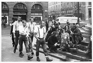On the steps of Eros, Piccadilly Circus,