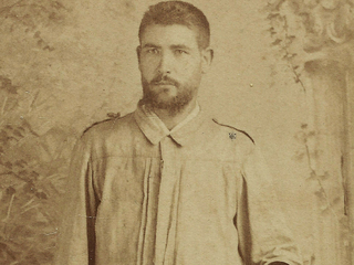 Spanish sergeant wearing a regulation guayabera,